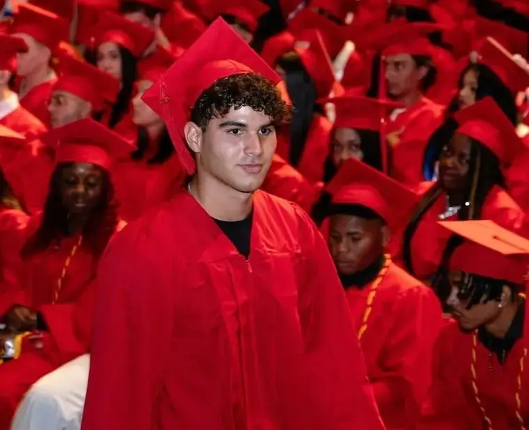 Graduate walking at commencement